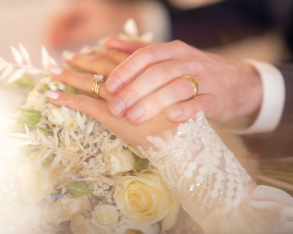 Wedding rings and wedding bouquet.